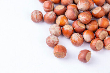Shelled hazelnuts on the white background