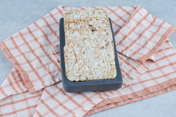 Puffed rice cake in tray on towel , on the marble background