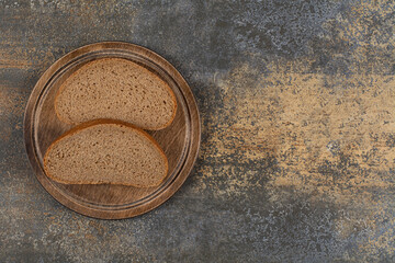Homemade black bread on wooden board