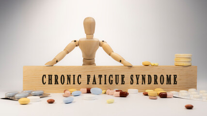 chronic fatigue syndrome Written on wooden surface. On wood and medicine concept. white background. Diseases and treatments