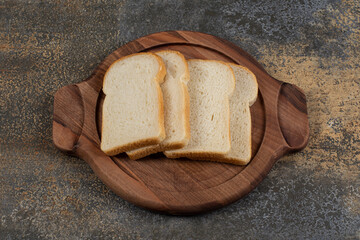 Homemade white bread on wooden board