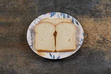 Sliced toast bread on colorful plate