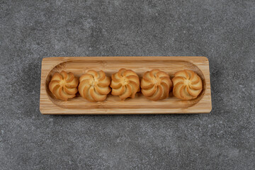Delicious biscuit on the tray , on the marble background