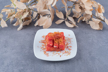 Turkish delight rahat lokum with pistachios on white plate