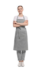 Beautiful young woman in clean apron on white background