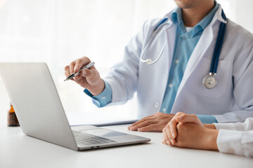 Close-up hands of doctor treatments and consults on patient in clinic medical office or hospital.