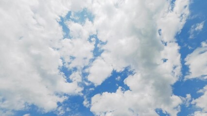 Milky magic sky. Daylight beauty. Aerial meditation. Clear blue heaven with white fluffy clouds flying in highness fast motion.