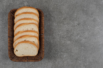 White bread slices in wooden basket