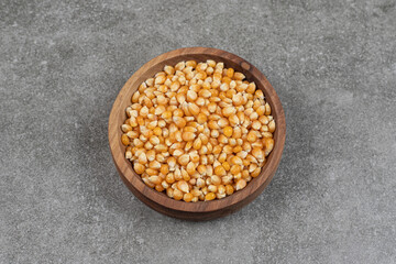 Pile of dried corns in wooden bowl