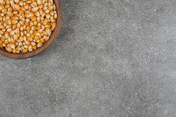 Pile of dried corns on wooden plate
