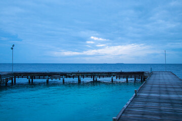 View of the pier and the ocean on a resort island in the Maldives