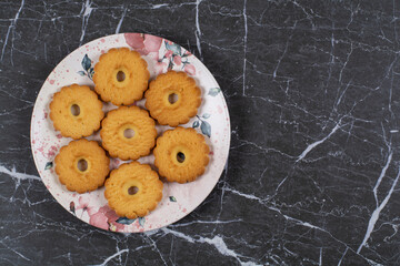 Shortbread cookies in the plate , on the marble background