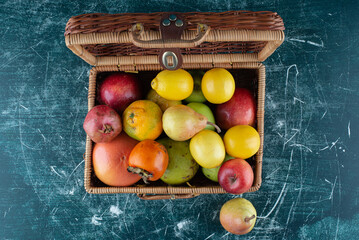 Assortment of fresh fruits in wooden bag
