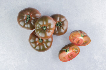 A stack of tomatoes on the marble background