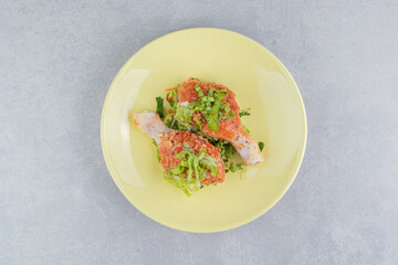 Raw marinated chicken meat, chicken legs in the plate, on the white background
