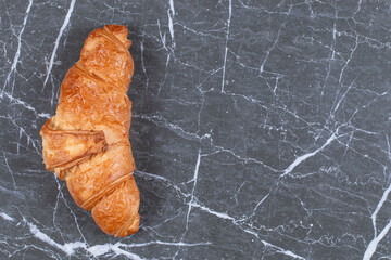 A display of chocolate croissant , on the marble background