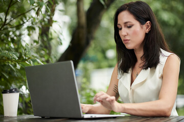 Businesswoman Concentrated on Answering E-mails