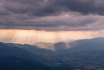 Sunset beams of light over the valley.