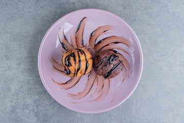 Two delicious sweet cupcakes on a plate