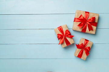 Gift boxes on wooden background, top view