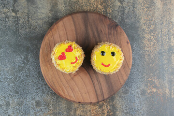 A wooden board with delicious sweet cakes