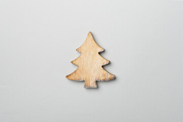 Wooden Christmas tree on color background, top view