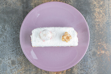 A purple plate of delicious cake with caramel