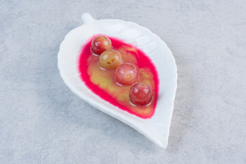Fresh homemade sweet dessert, white plate on grey background