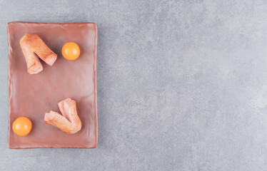 Tasty tomato and sausage on the plate , on the marble background