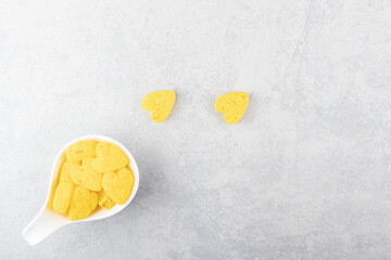A spoonful yellow cookies on the blue background