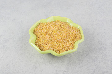 A bowl of toothsome rice on the marble background