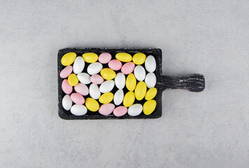 Assorted gums in the tray, on the marble background