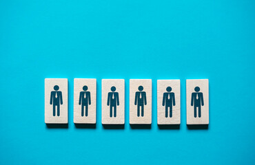 Figurines of company employees. Assemble an effective departmental team. Hiring, recruiting. Leadership, management skills and discipline. Human resources. Teamwork. Organization of employees.