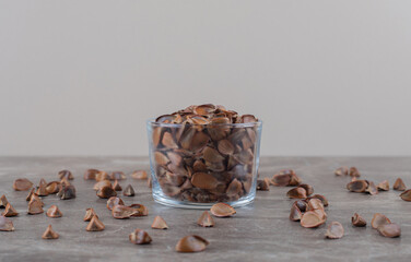 Toothsome seeds in a bowl ,on the marble background
