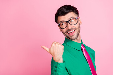 Closeup side profile of young guy smiling office worker recommend ad looking pointing empty space...