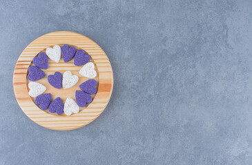 Heart shaped cookies on the plate, on the marble background