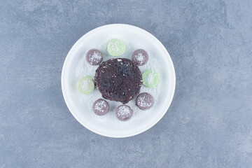 Chocolate cake and sweet cookie, on the marble background