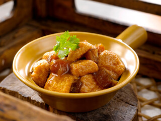Tofu served in a Claypot isolated on table side view