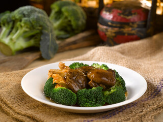 Diced Thick Mushroom with Beancurd Skin and Broccoli served in a dish isolated on table side view