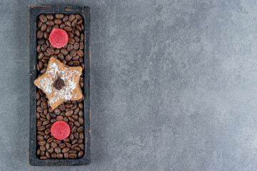 Cookie star with jelly candies and coffee beans