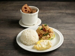 Cereal Chicken Bento with white rice and soup served in a dish isolated on table side view