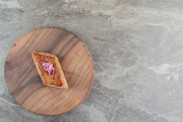 Homemade tasty pastry on wooden board