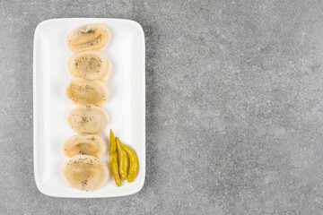 Dumplings filled with meat on white plate