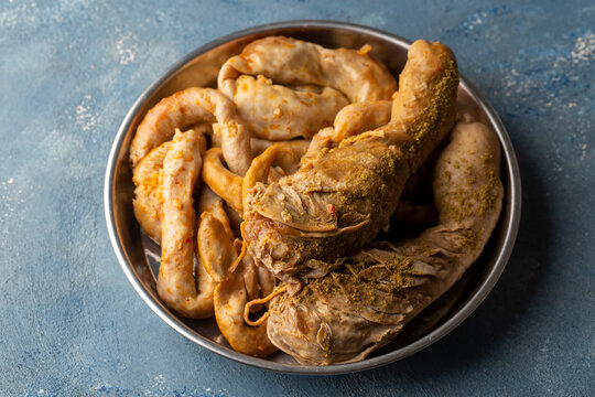 Turkish Traditional Food Rice Stuffed Intestines Tripe Sirdan Dolma - Shirdan from Adana Offal Food at Local Restaurant. Organic Food. (Turkish name; Sirdan and mumbar)