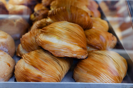 sfogliatella is a traditional Italian dessert. Shell-shaped pastry with ricotta cream. The concept of Italian food.