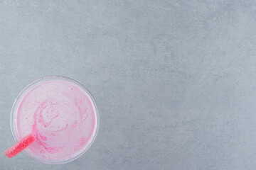 Flavorful strawberry milk shake on the marble background