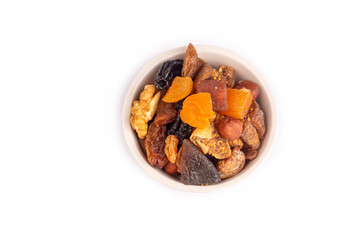 Mixed nuts and dried fruits on the white background