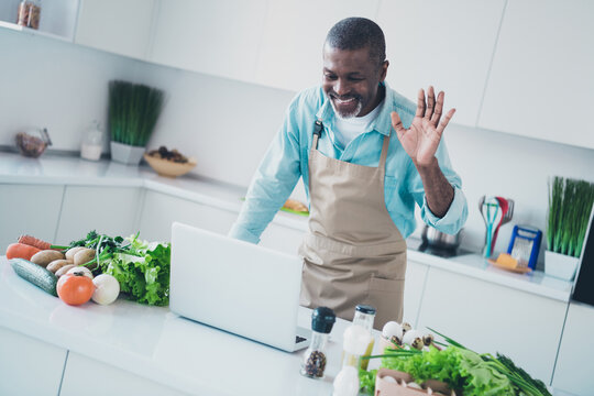 Photo of positive friendly age man wear apron cooking lunch recording cooking video blog indoors room home