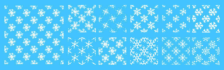 a set of patterns of isolated white snowflakes. seamless pattern of simple doodle snowflakes isolated on blue for winter holidays