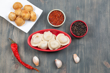 Delicious dumplings with garlic segments and red pepper